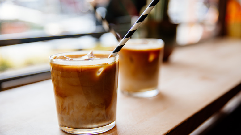 Iced coffees on wooden table