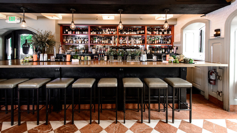 Wine bar, checkered floor pattern at a.o.c.