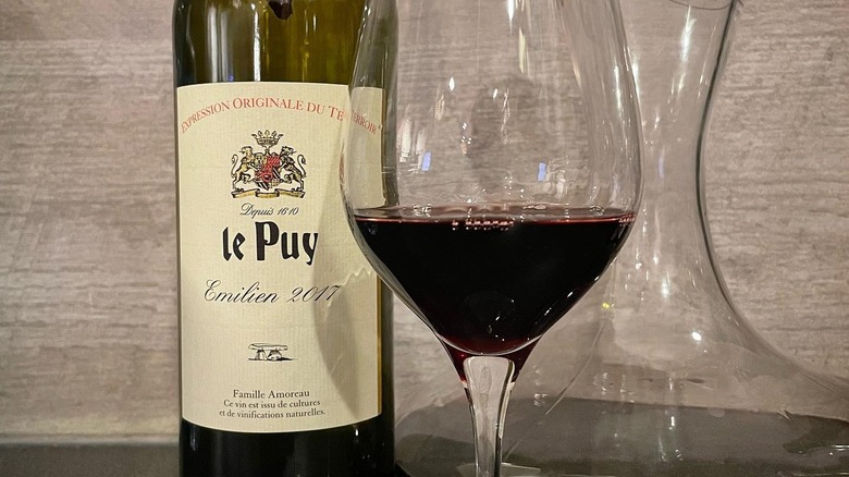 Chateau le Puy bottle with glass