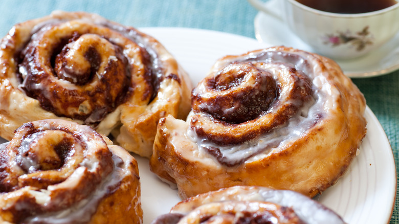 Cinnamon buns on plate with coffee