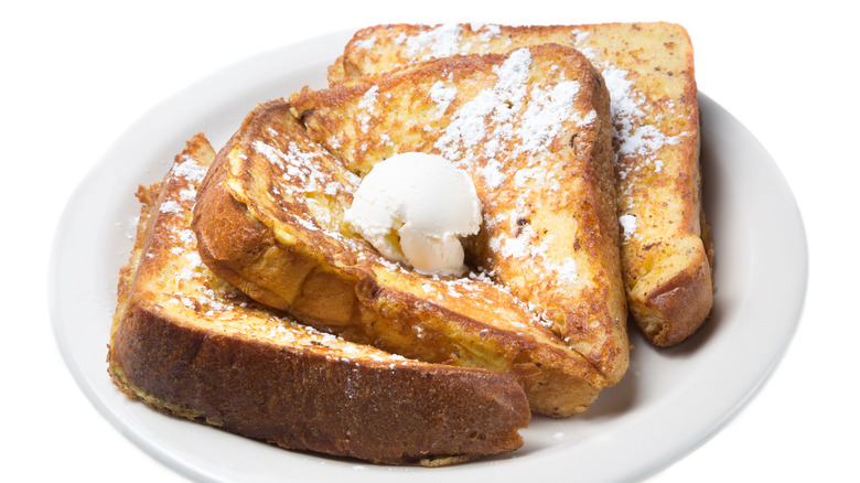 French toast with butter on plate