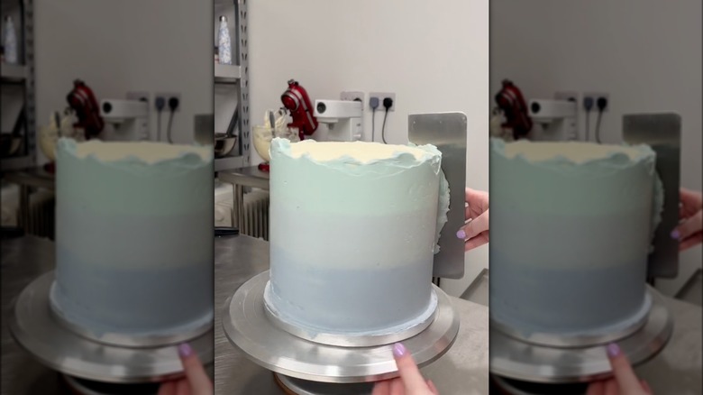 scraping frosting on ombre cake