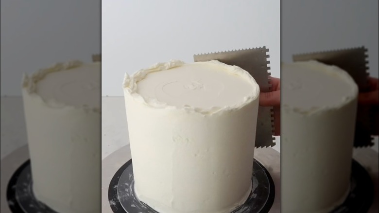 using bench scraper on cake