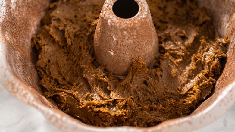 Filling bundt tin gingerbread cake