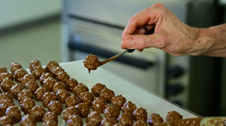 Person making chocolate truffles