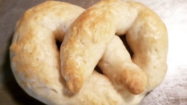 Biscuit dough pretzel on pan