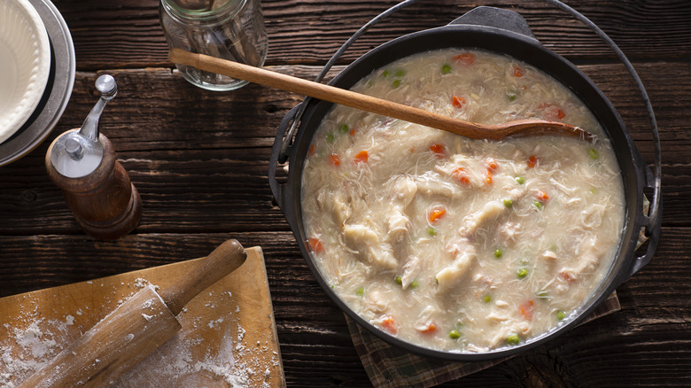 Chicken and dumplings in pot