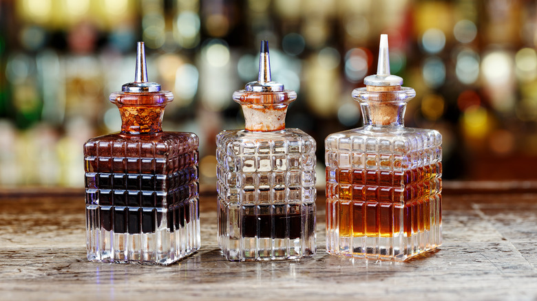 Three decanters of cocktail bitters