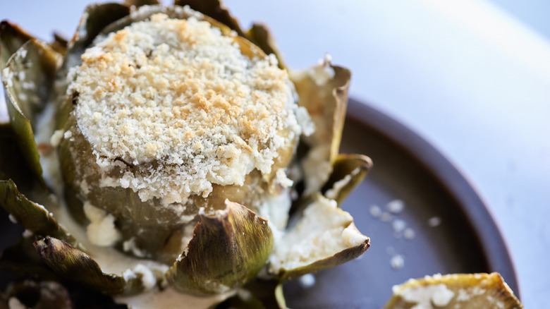 cheesy artichoke on plate