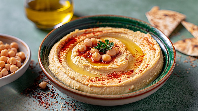 Chickpea hummus in green bowl