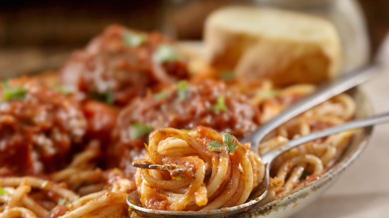 Pasta with sauce and spoon