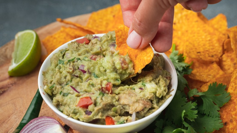 Dipping chips into guacamole