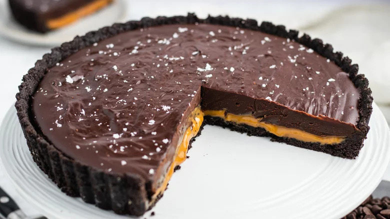 sliced chocolate caramel tart