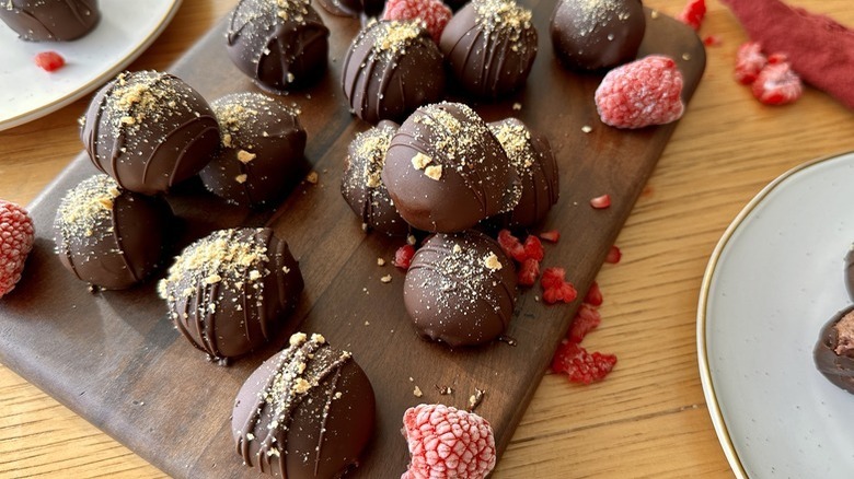 raspberry truffles on serving board