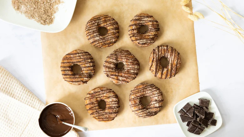 chocolate cronuts on parchment paper