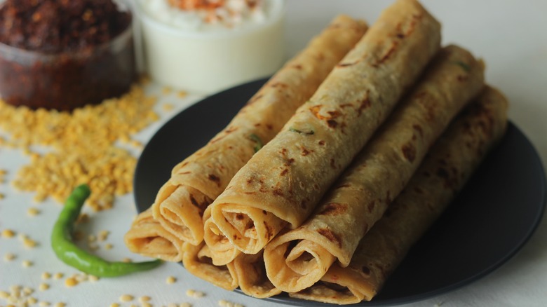 Rolled up paratha flatbreads on a plate