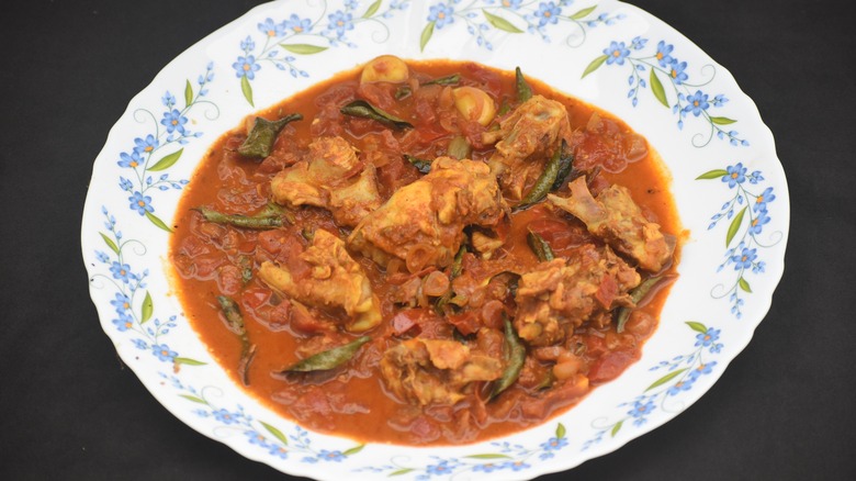 Chicken Chettinad dished in a white decorative bowl