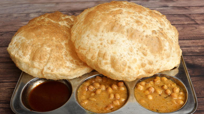 Chole bhature spicy chickpea stew with fried flatbread