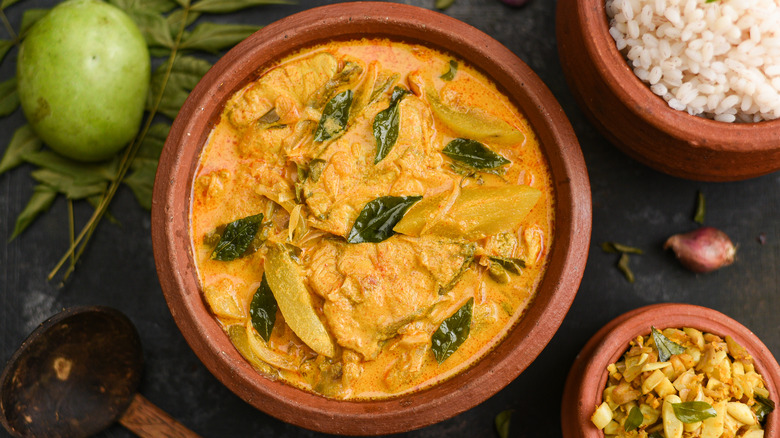 goan fish curry in clay bowl