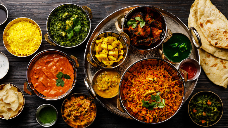 Assortment of Indian dishes on a wooden table