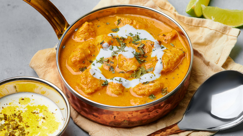 Butter chicken in a copper pan