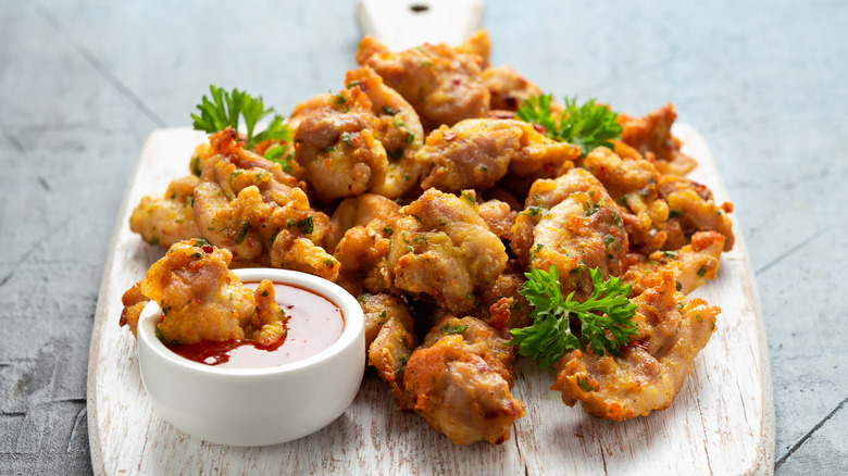 Pakoras and dip on a wooden board