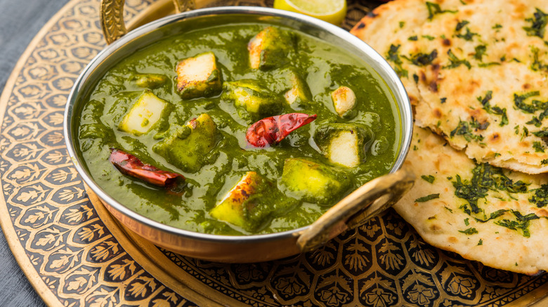 Palak paneer and naan plated