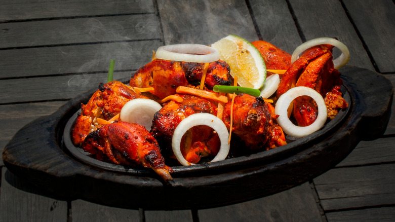 Tandoori chicken on a hot plate