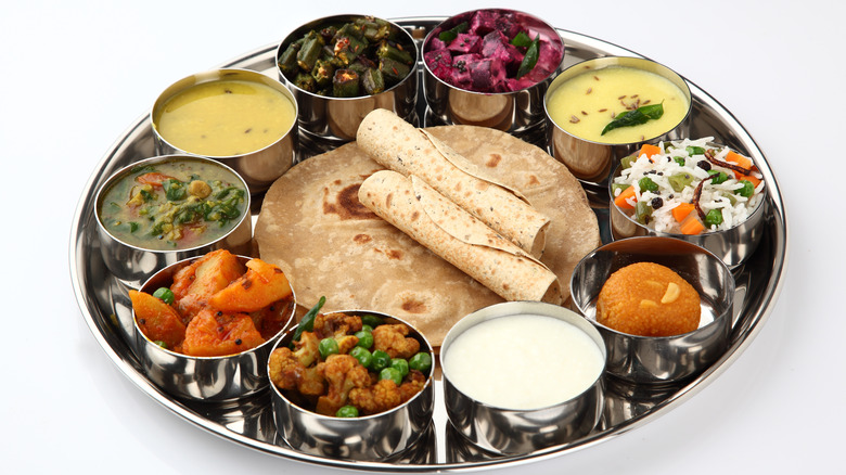 Thali platter plated in a metal dish