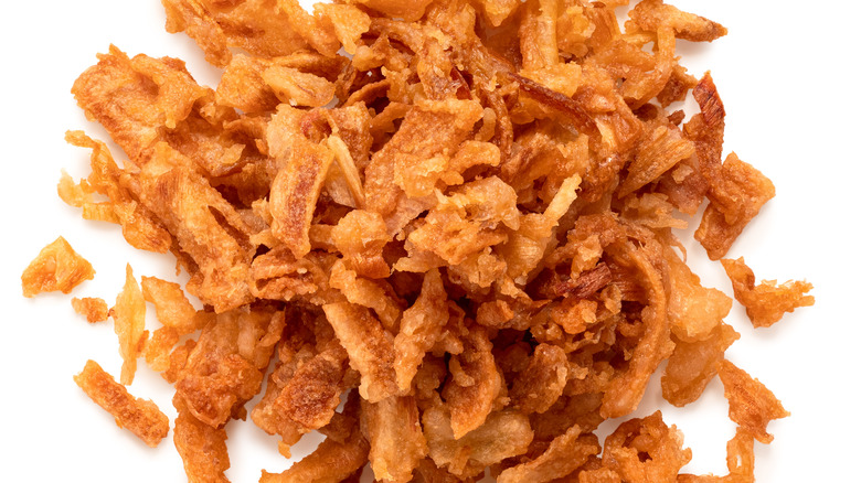 Crispy fried onions on white background