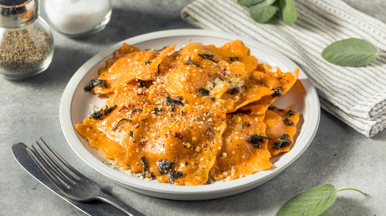 Orange ravioli with herbs and sage