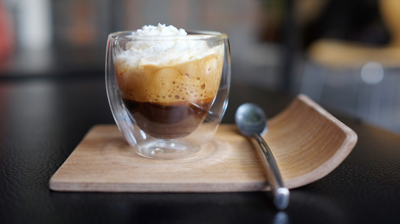 An espresso shot with whipped cream