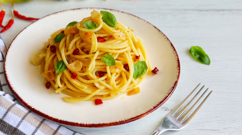 plate of spaghetti with garlic and herbs