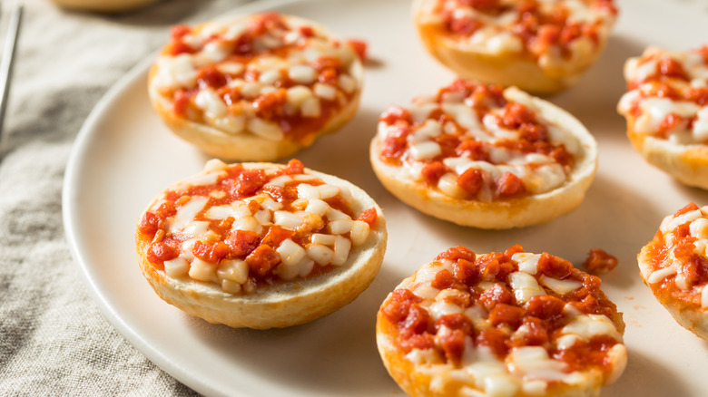 Pizza bagels on white plate