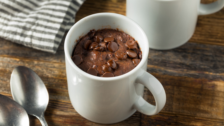 Chocolate mug cake wooden table