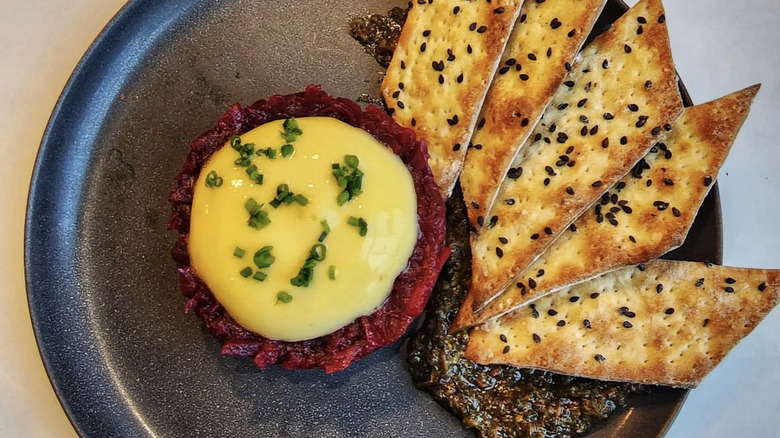 Beet tartare with orange foam and broccoli pesto