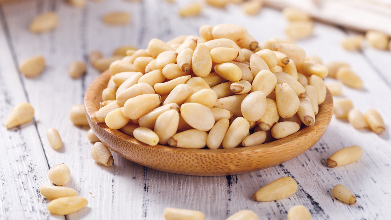 pine nuts in wood bowl