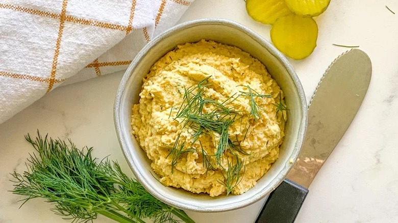 Dill pickle hummus in bowl