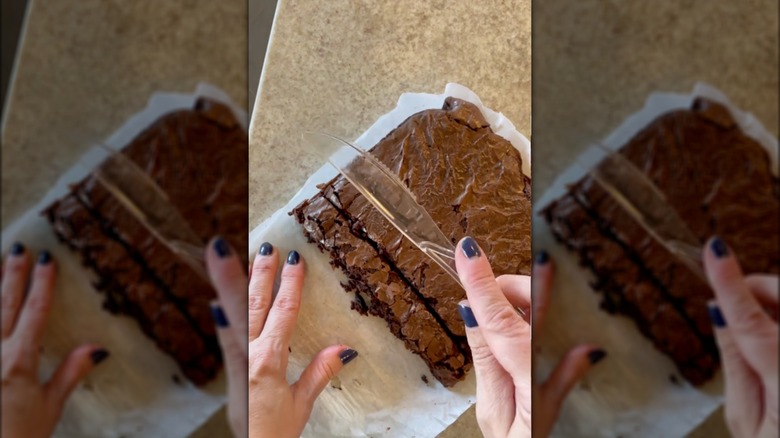 plastic knife cutting brownies