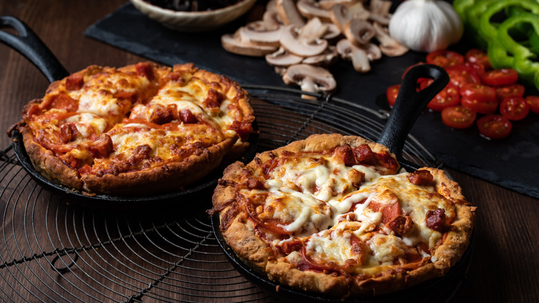 Deep dish pizzas in cast iron