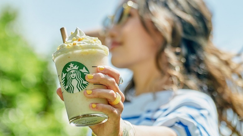 Woman holding frappuccino