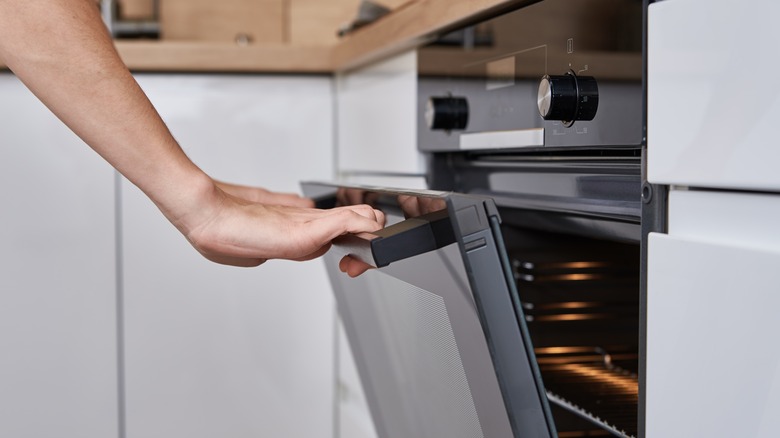 Person opening oven