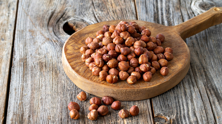 hazelnuts on wooden board