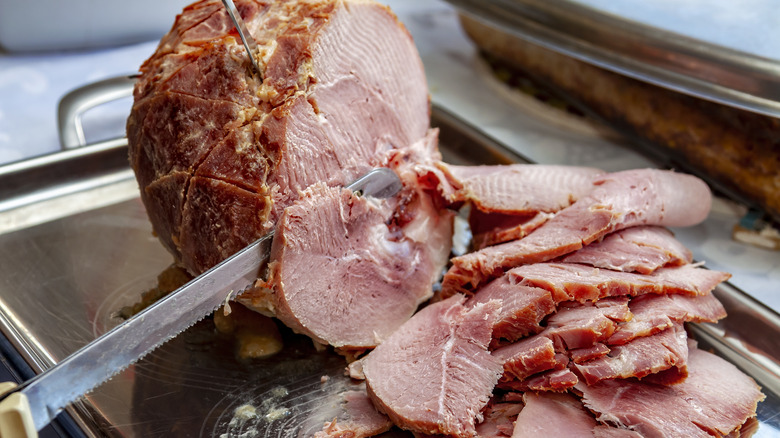 Sliced ham on metal tray