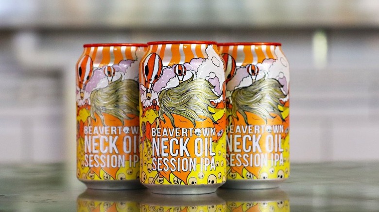 Three cans of Beavertown Neck Oil showcased together