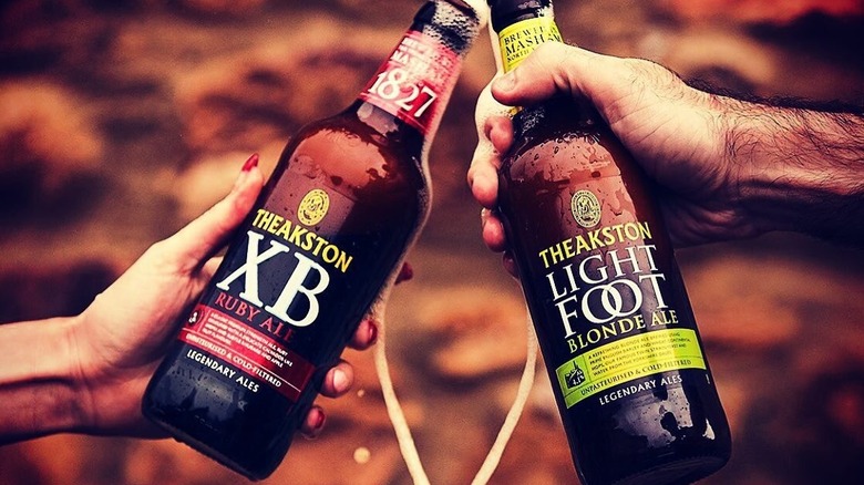 Two Theakson bottles being shown to the camera