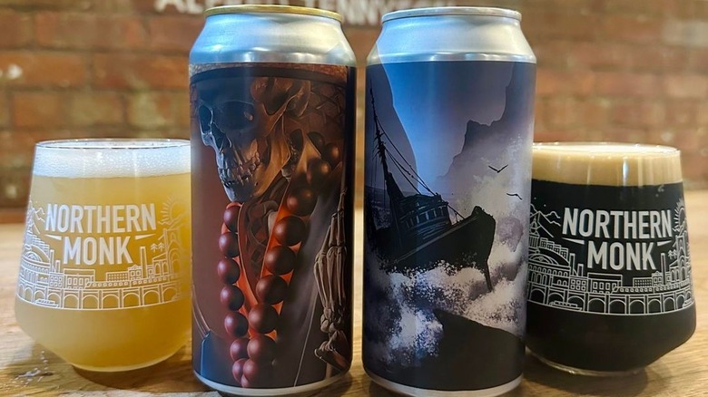 Two Northern Monk cans and full glasses next to them