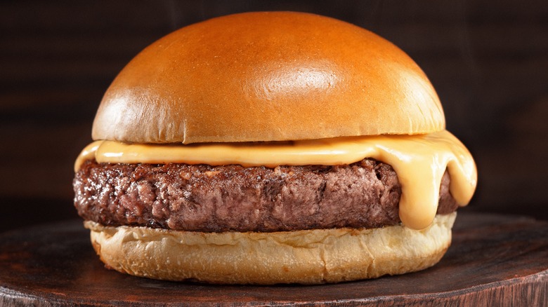 Cheeseburger on wooden surface