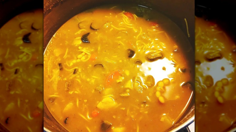 Yellow soup with corn 