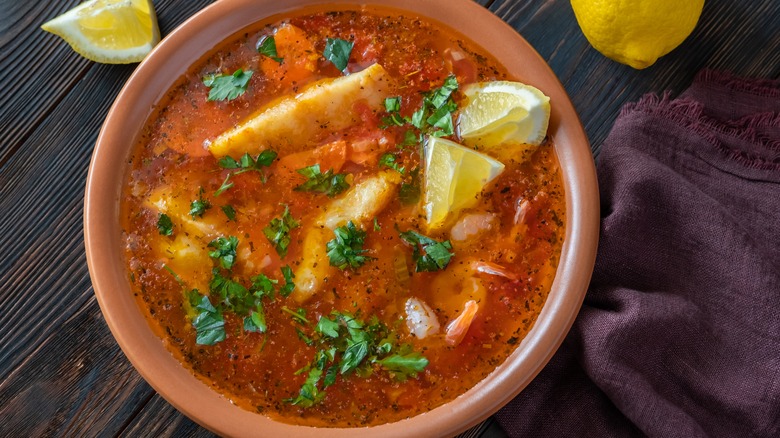 Red broth in clay bowl 